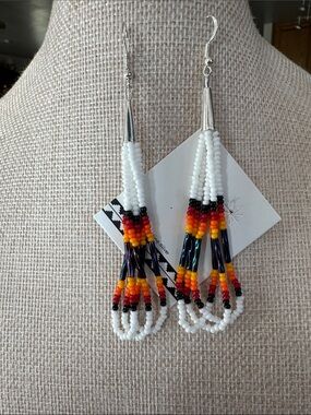 Indigenous White Beaded Earrings with Red Orange Yellow and Black Accents